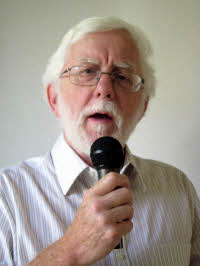 Graham Foster holding microphone
